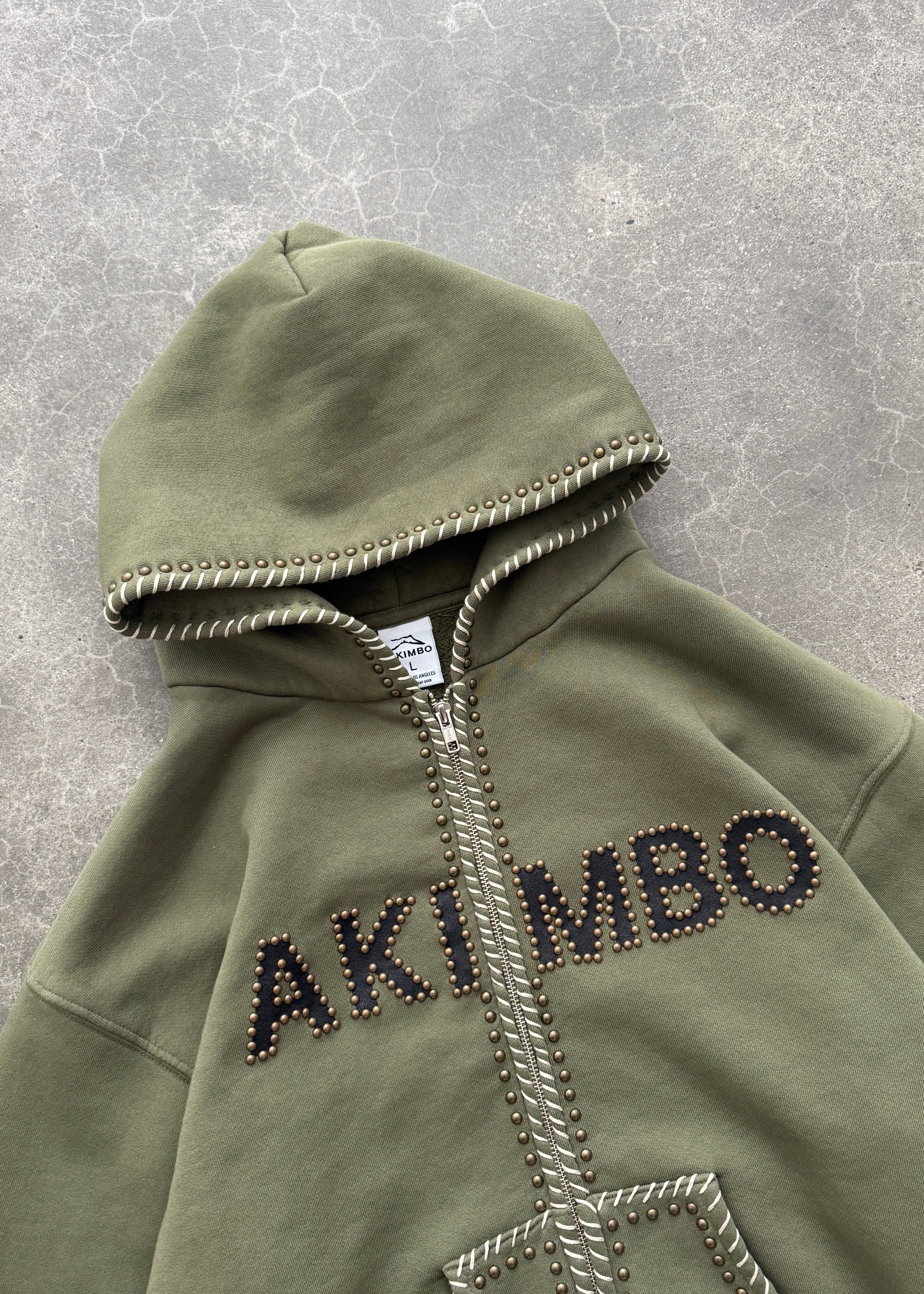 STUDDED TRAINING ZIP-UP HOODIE - OD GREEN