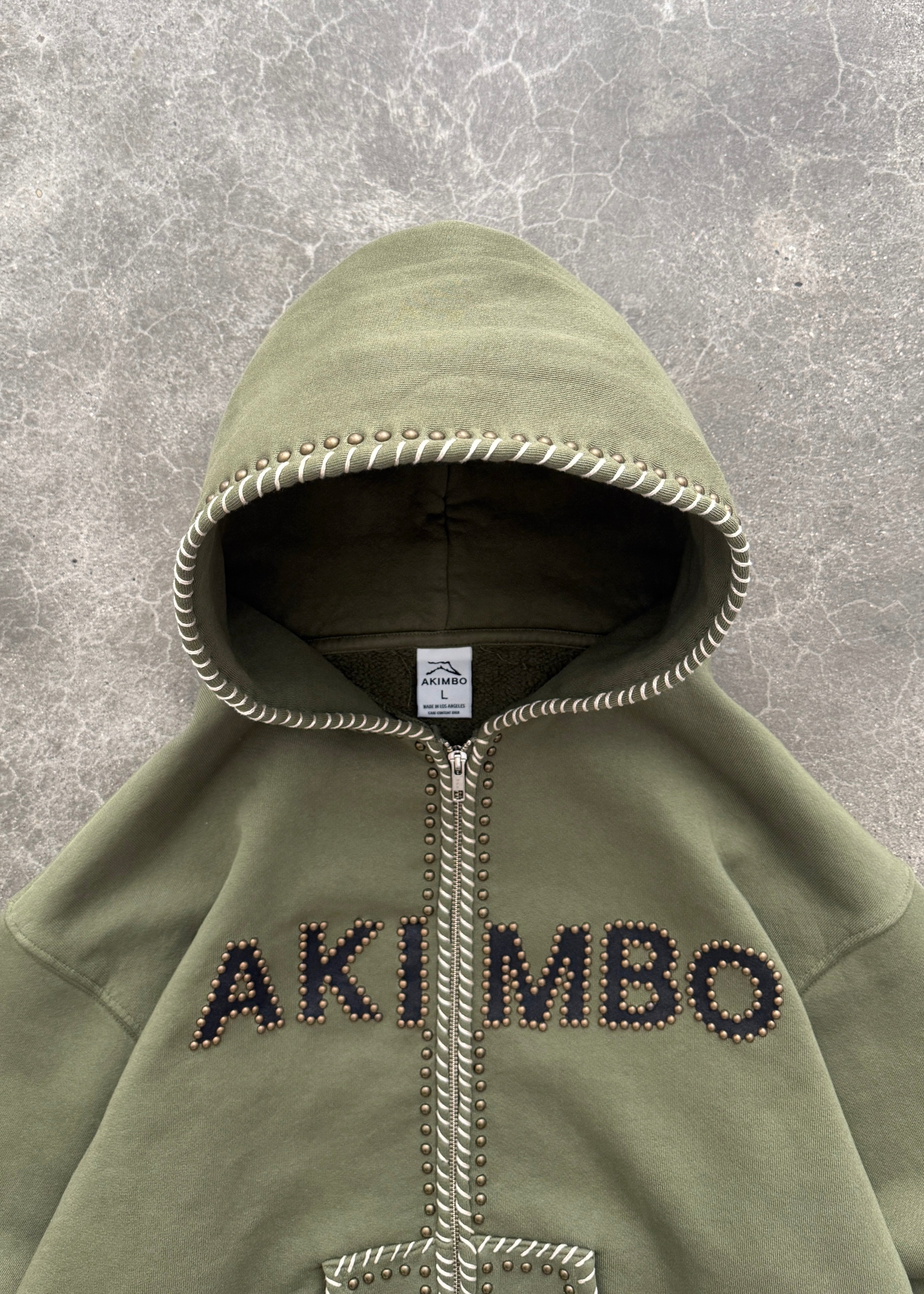 STUDDED TRAINING ZIP-UP HOODIE - OD GREEN