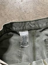 Load image into Gallery viewer, CARHARTT DISTRESSED &amp; FADED OLIVE GREEN DOUBLE KNEE PANTS
