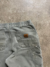 Load image into Gallery viewer, CARHARTT DISTRESSED &amp; FADED OLIVE GREEN DOUBLE KNEE PANTS
