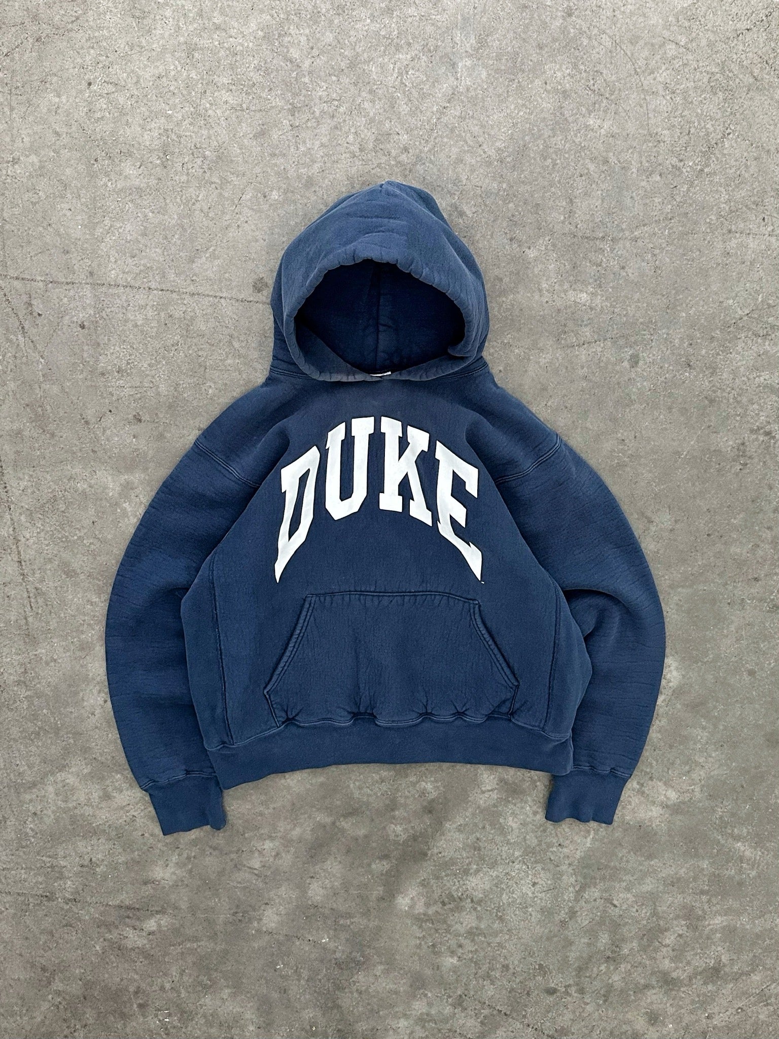 FADED NAVY BLUE “DUKE” HEAVYWEIGHT HOODIE - 1990S – AKIMBO CLUB