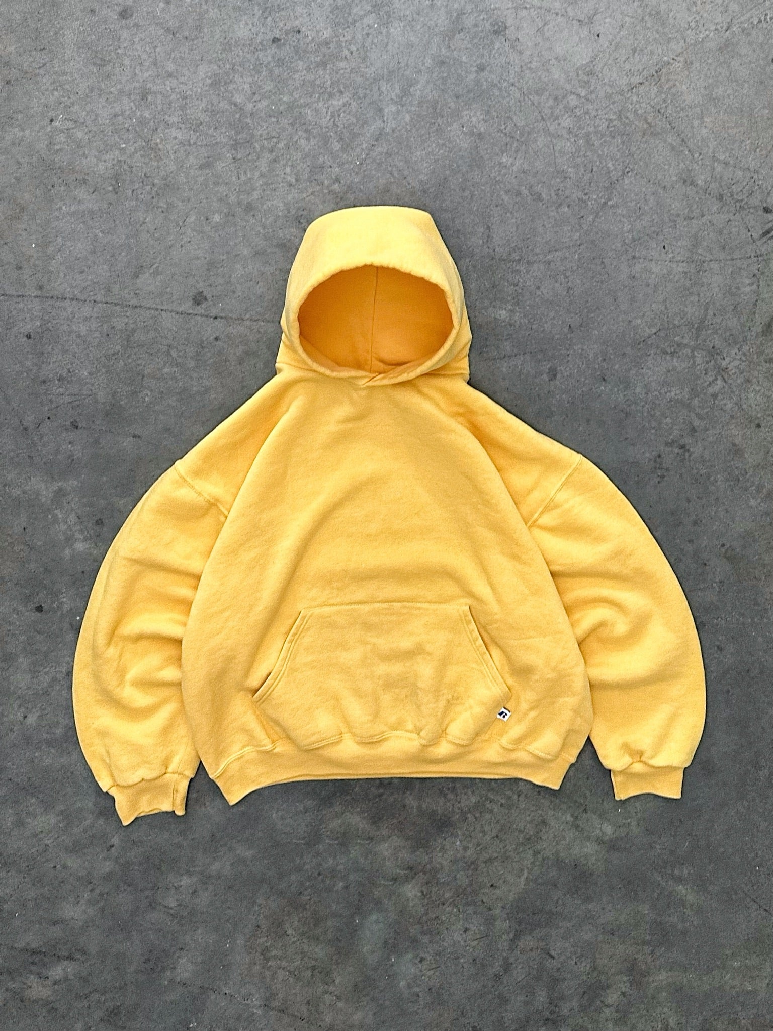 FADED YELLOW RUSSELL HOODIE - 1990S – AKIMBO CLUB