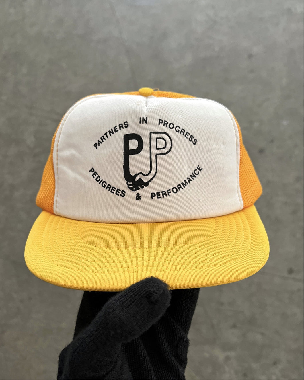 “PARTNERS IN PROGRESS” YELLOW FOAM TRUCKER HAT - 1990S